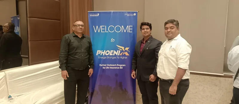 Nikhil Gadkarr with two colleagues at a Phoenix partner outreach programme run by a life insurance business unit